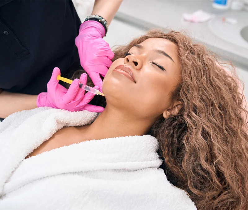 Woman receiving BOTOX on her cheek