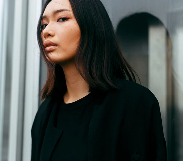 Asian woman in dressed all in black