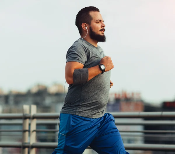 Larger sized man exercising / jogging